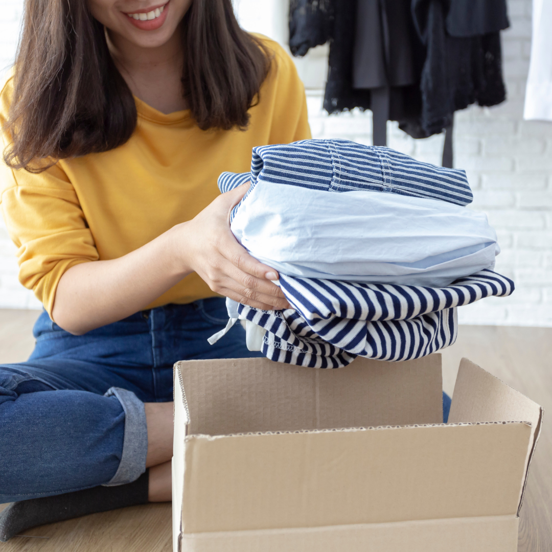 71 woman donating used clothes