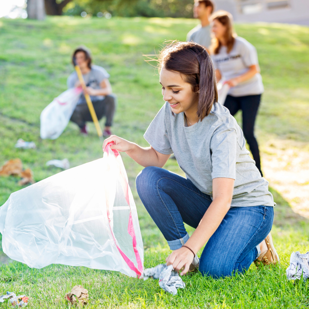 girl picking up litter